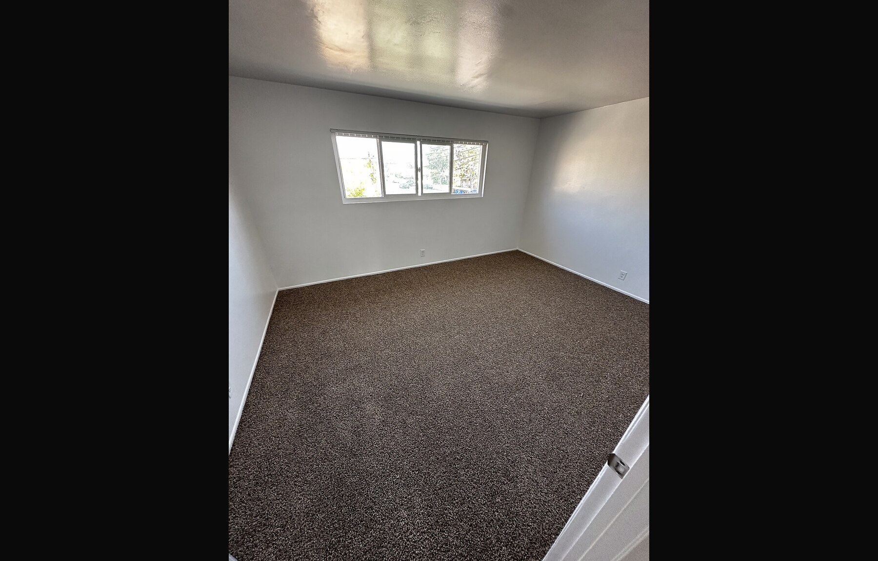After: new carpet installed in bedroom